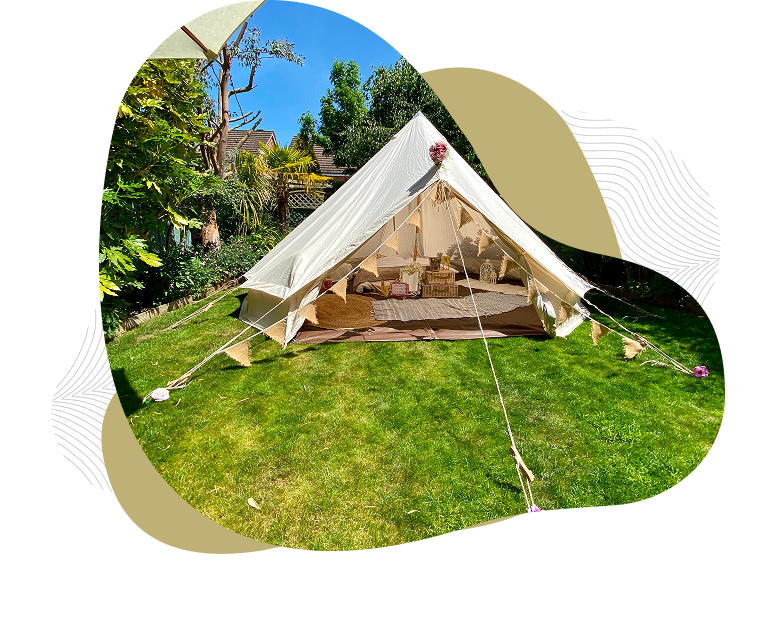 Cozy outdoor tent on green lawn.
