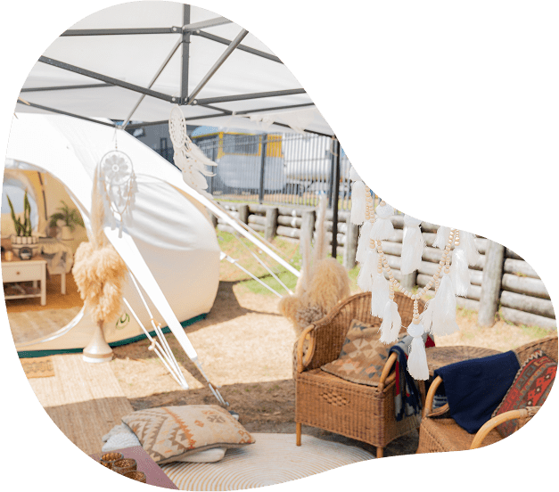 Bohemian outdoor setup with wicker furniture.